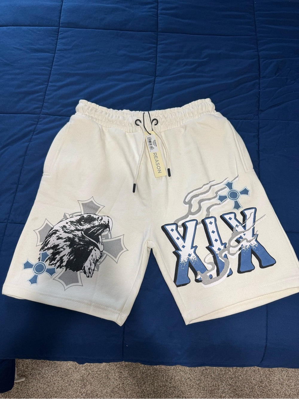Reason Men's White Graphic Eagle Shorts with Blue Accents